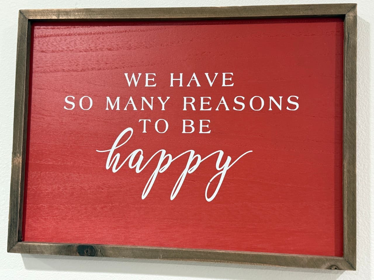 Happy residents at Warm Beach sign