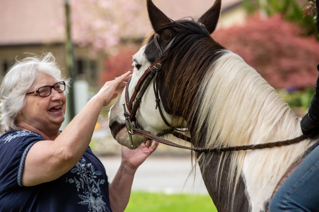 Memory care resident enjoying pet therapy